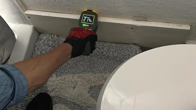 Moisture meter reading taken during an inspection